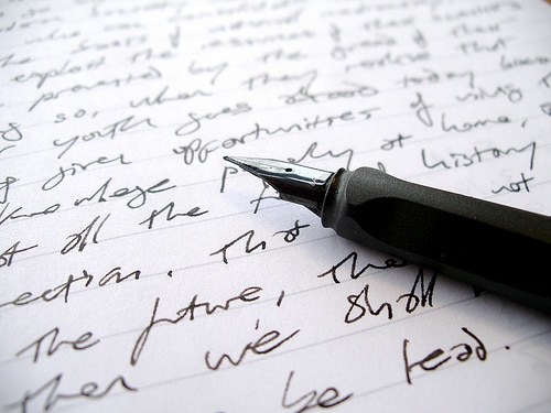 fancy pencil and open notebook