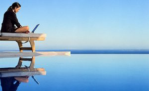 woman-laptop-by-pool[1]